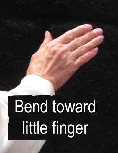 Bend toward thumb - this photo and previous one look like someone is waving their right hand from side to side, this one shows the hand tilted to the left